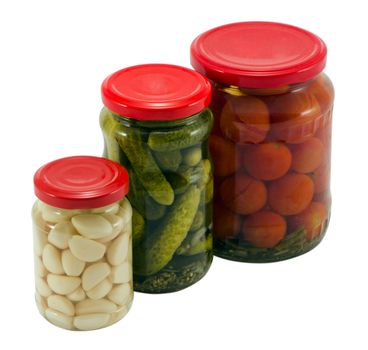 garlic cucumber tomatoes canned preserved in glass pots jars isolated on white background ecological natural food resource for winter