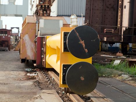 two black bumpers on shipyard crane