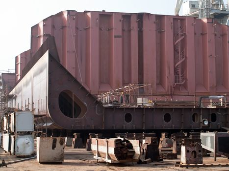 new ship in construction on slipway in shipyard