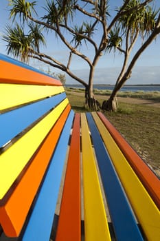 Striped vibrant bench in a park