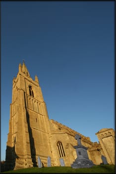 Old church in Epingham against blue sky