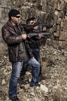 View of a group of gang members with guns.