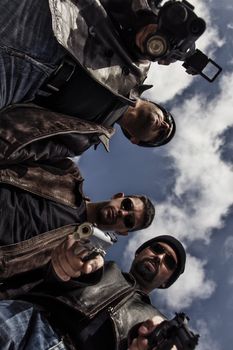 View of a group of gang members with guns.