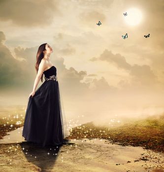 Beautiful girl at a brook under the moon light (with butterflies)