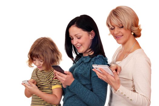 little girl teenage girl and woman playing with smart phone and tablet