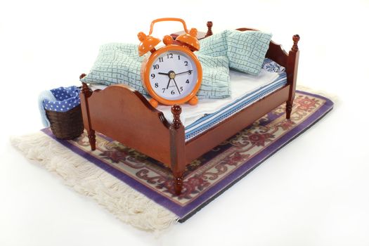 a wooden bed and alarm clock on a white background