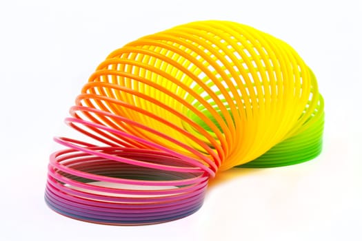 Slinky Toy isolated over a plain white background.