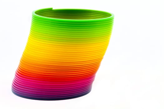 Slinky Toy isolated over a plain white background.