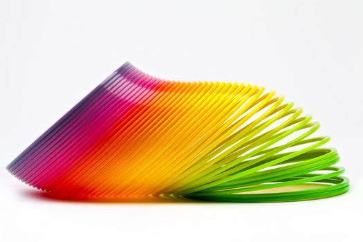 Slinky Toy isolated over a plain white background.