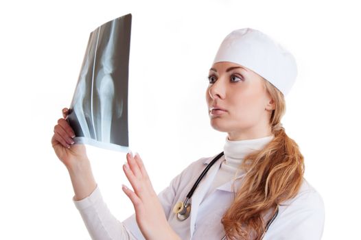 Female doctor examning x-ray isolated on white