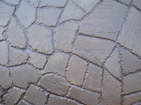          The texture of wet stone with processed edges brown                      