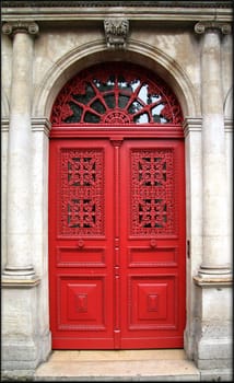 Red old wooden door in Paris
