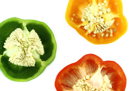 slices of colorful sweet bell pepper on white background
