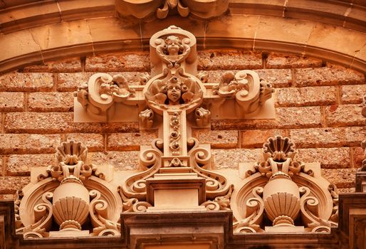 Cross Angel Statues Golthic Cloister Monestir Monastery of Montserrat, Barcelona, Catalonia, Spain.  Founded in the 9th Century, destroyed in 1811 when French invaded Spain. Rebuilt in 1844 and now a Benedictine Monastery.  Placa de Santa Maria