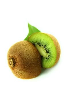 Juicy kiwi fruit and leaves isolated on white