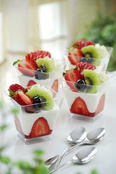 Yogurt in glass and fruit