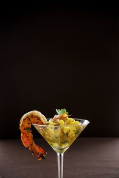 Shrimp cocktail on dark background