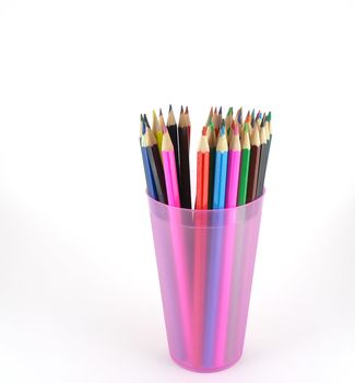 Color pencils in the pink prop over white