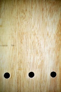 three hole on a wood board