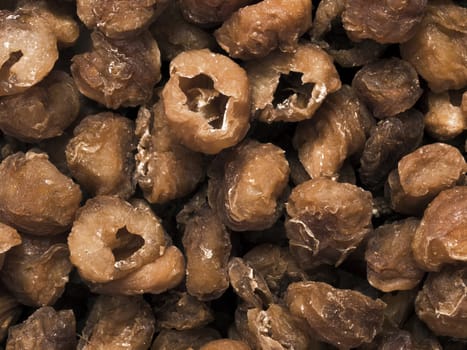 close up of a heap of dried longan fruit food background