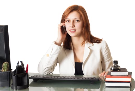 woman calling on the phone while sitting at a desk in an office on a white background isolated