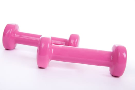 pink dumbbells on a white background