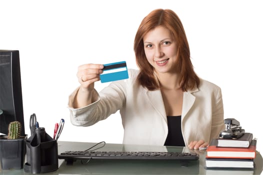 woman manager showing a credit card sitting at a desk in an office