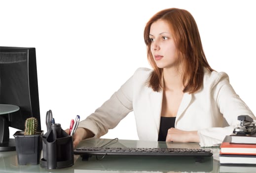 woman manager sitting at the computer in the office on a white background isolated