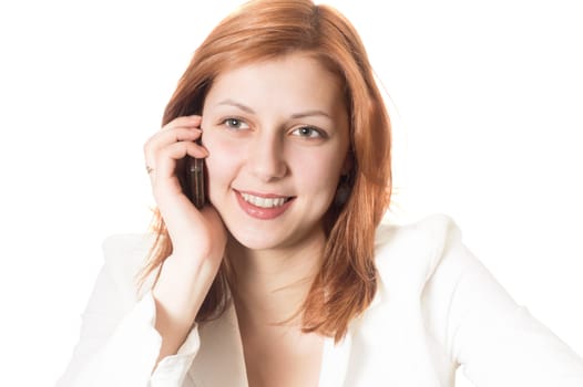 girl with golden hair talking on a mobile phone on a white background isolated
