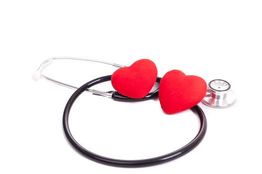 Stethoscope and heart on a white background