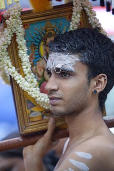 Devotee walking in the Thaipusam festival in Singapore