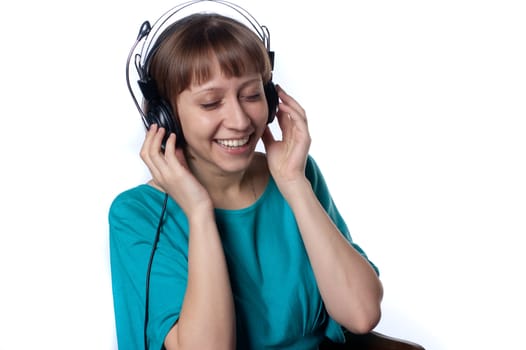 girl enjoys mgirl enjoys music on headphones