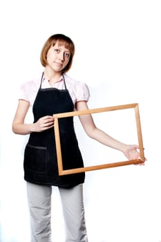 young girl in an apron holding a frame