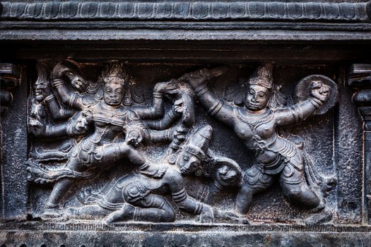 Bas relief depicting Durga slaying demon (Maheeshasuramardini). Brihadishwara Temple. Tanjore (Thanjavur), Tamil Nadu, India. The Greatest of Great Living Chola Temples - UNESCO World Heritage Site