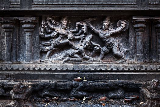 Bas relief depicting Durga slaying demon (Maheeshasuramardini). Brihadishwara Temple. Tanjore (Thanjavur), Tamil Nadu, India. The Greatest of Great Living Chola Temples - UNESCO World Heritage Site