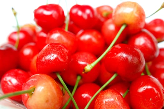 Red cherry fruits on a white background