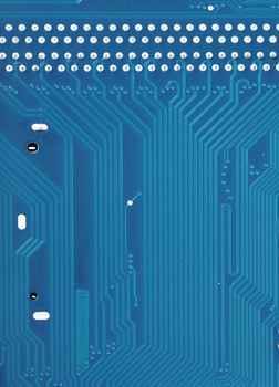 Closeup view of tracks of blue printed circuit board