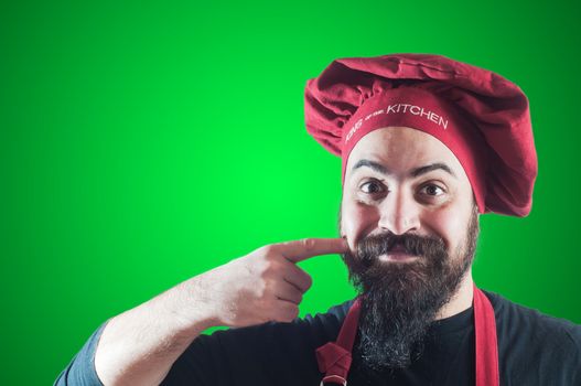 happy bearded chubby chef on green background