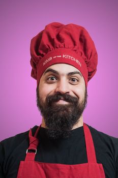 happy bearded chubby chef on pink background