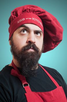 happy bearded chubby chef on blue background