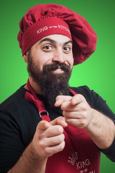 happy bearded chubby chef on green background