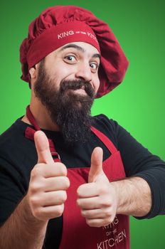 happy bearded chubby chef on green background