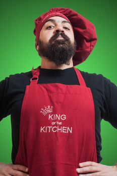 happy bearded chubby chef on green background