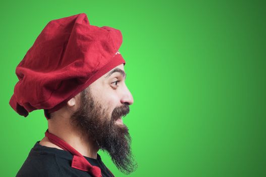 happy bearded chubby chef on green background