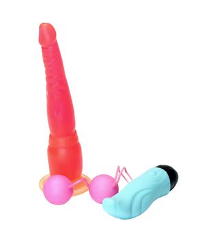 Pink vaginal balls, vibrator and dildo it is isolated on a white background.