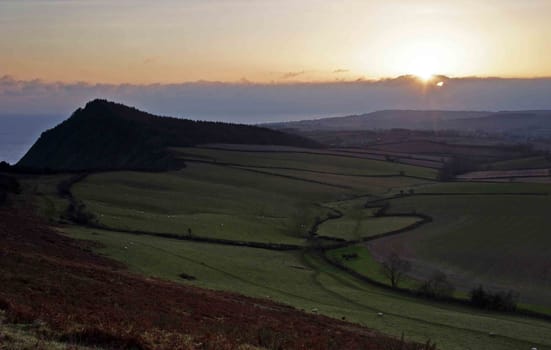 Sunset across the rolling hills of devon