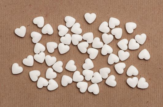 white pills in the form of heart