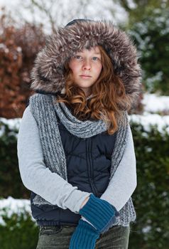 Outdoor portrait of a teenager girl in winter cloths