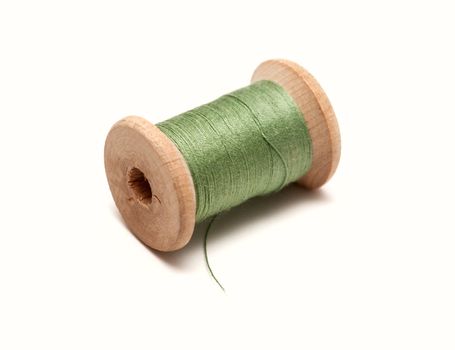 Thread bobbin on white background