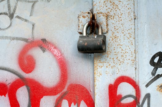 Door lock on the valve metal gate. Texture, background